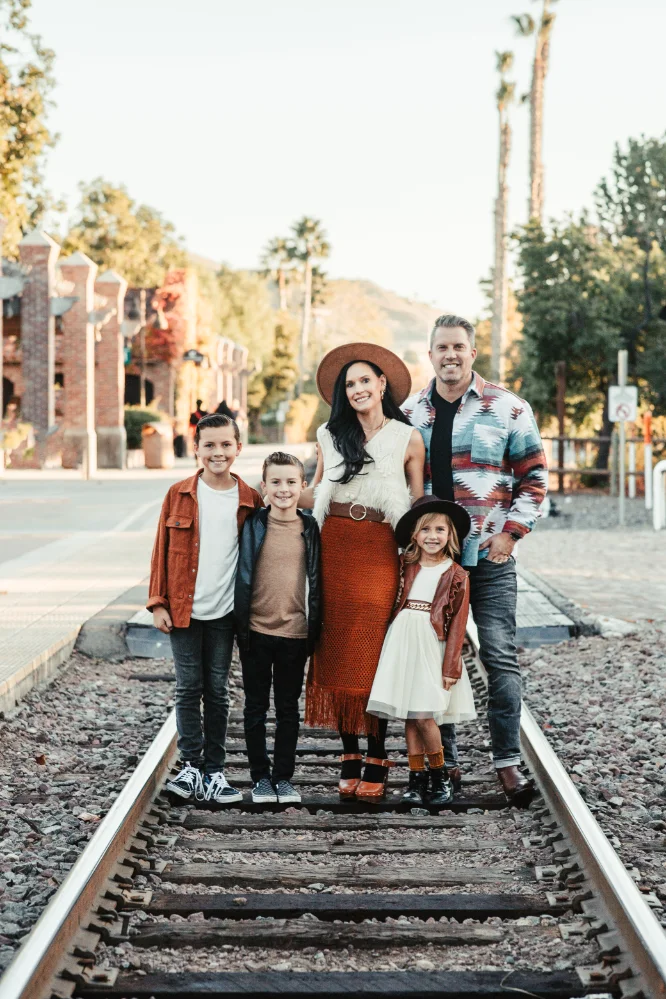 Tim Lukei and family on train tracks